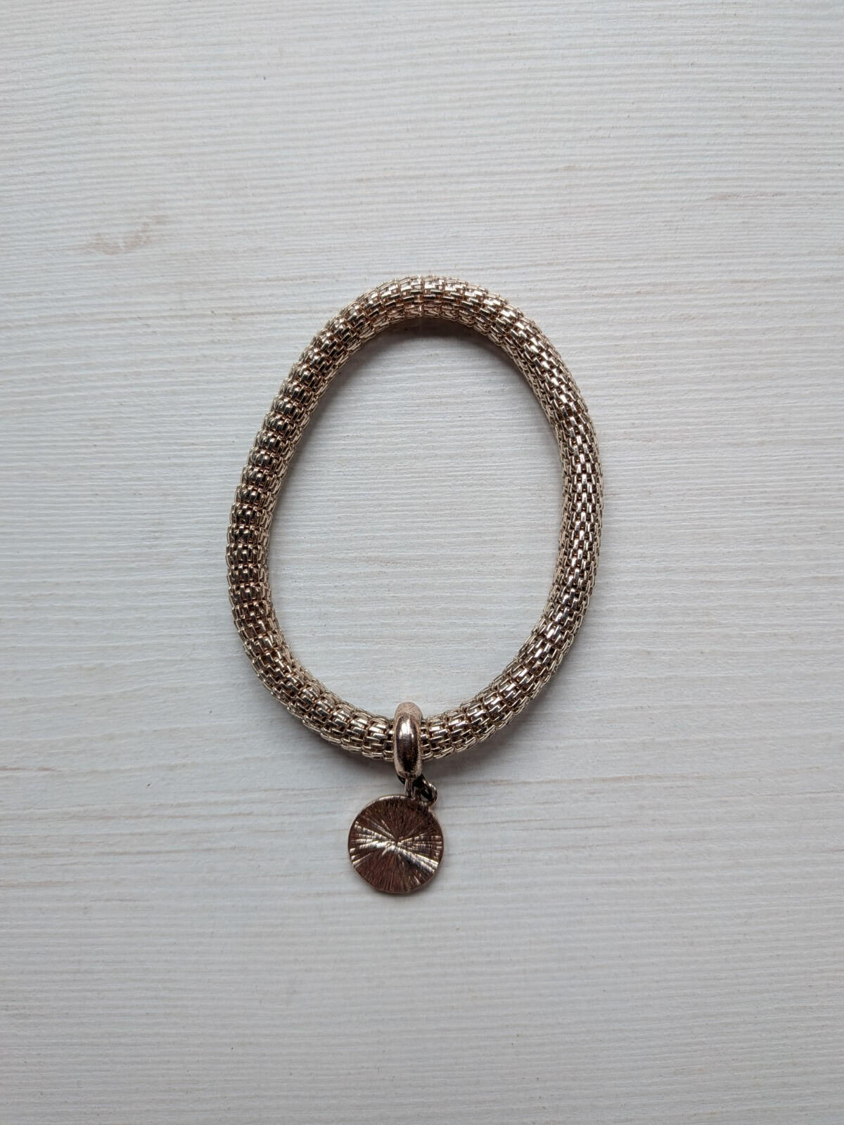 Rose Gold Toned Metal Mesh Bracelet with Circular Charm