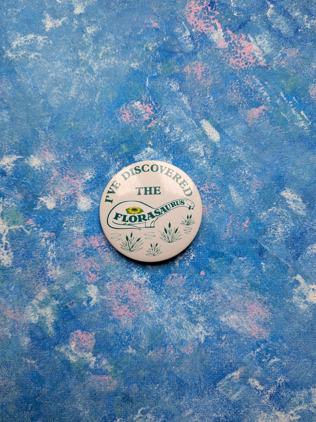 Vintage Flora Spread "I've Discovered The Florasaurus" Dinosaur Badge