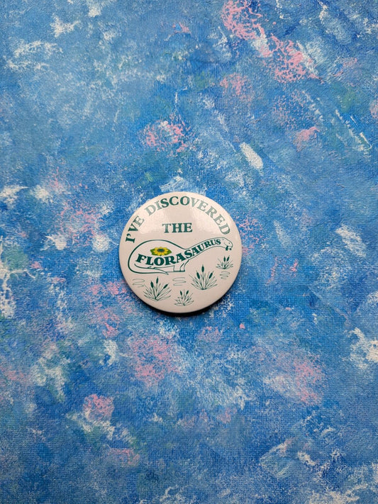 Vintage Flora Spread "I've Discovered The Florasaurus" Dinosaur Badge