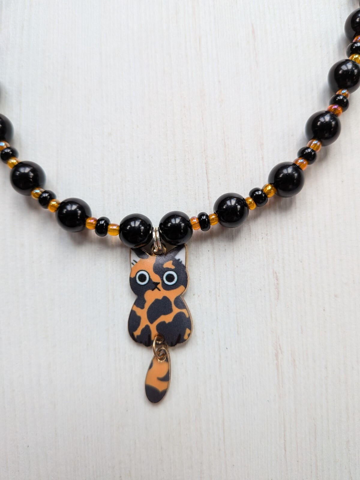 Black and Orange Plastic Beaded Choker Necklace with Metal Cat Pendant